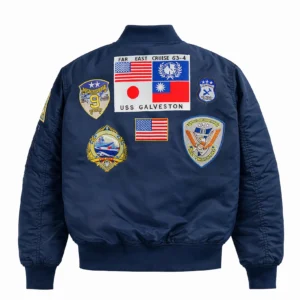 Close-up shot of precision embroidered naval air squadron patches on olive bomber jacket